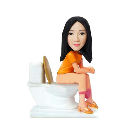 Op maat gemaakte bobbleheads voor op het toilet